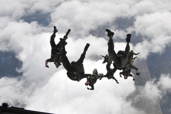 Canadian soldiers jumping from plane