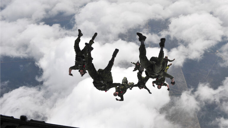 Canadian soldiers jumping from plane