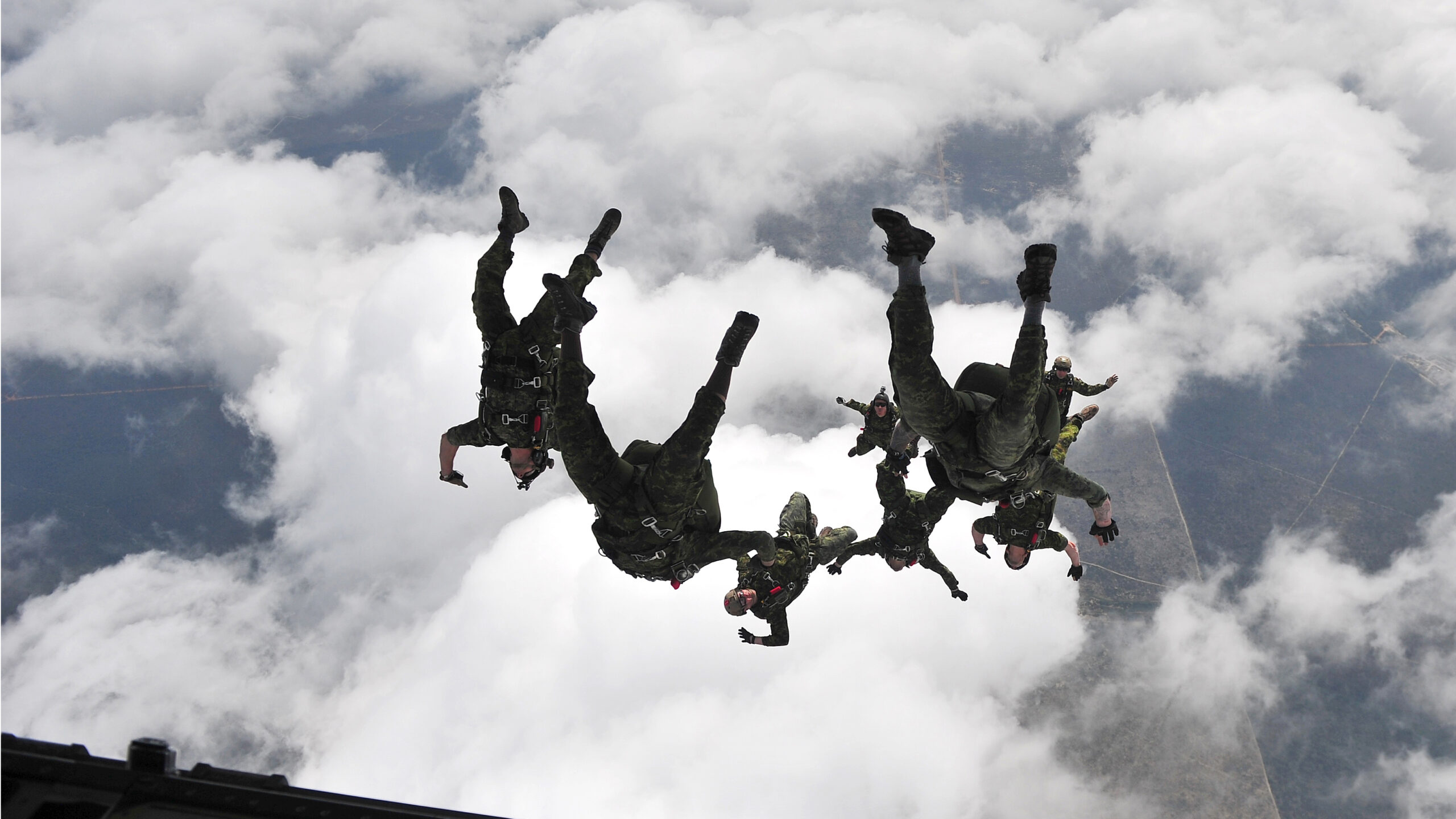 Canadian soldiers jumping from plane